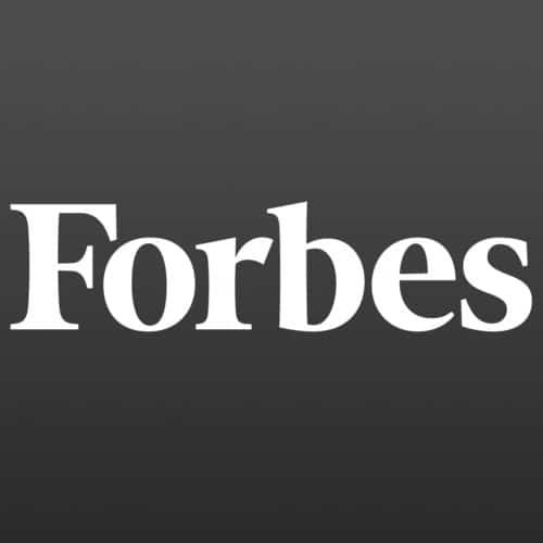 The image shows the Forbes logo, featuring the word Forbes in white serif font against a dark gray background.